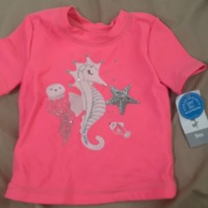 Selling a swim shirt.The Brand is Carters. The color is pink with a sea horse.